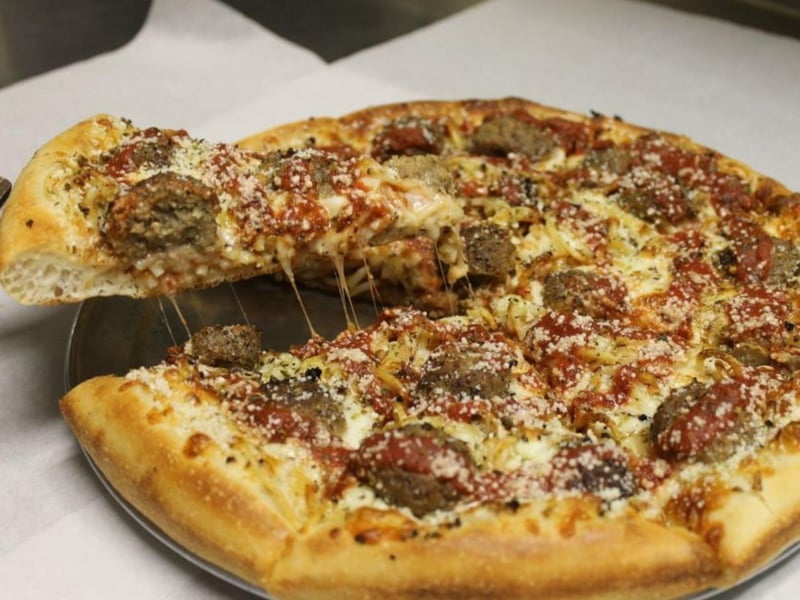 A spaghetti and meatball pizza