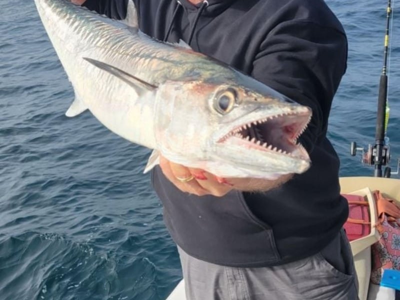 A man showing off his catch on board in Fort Walton Beacch, Florida