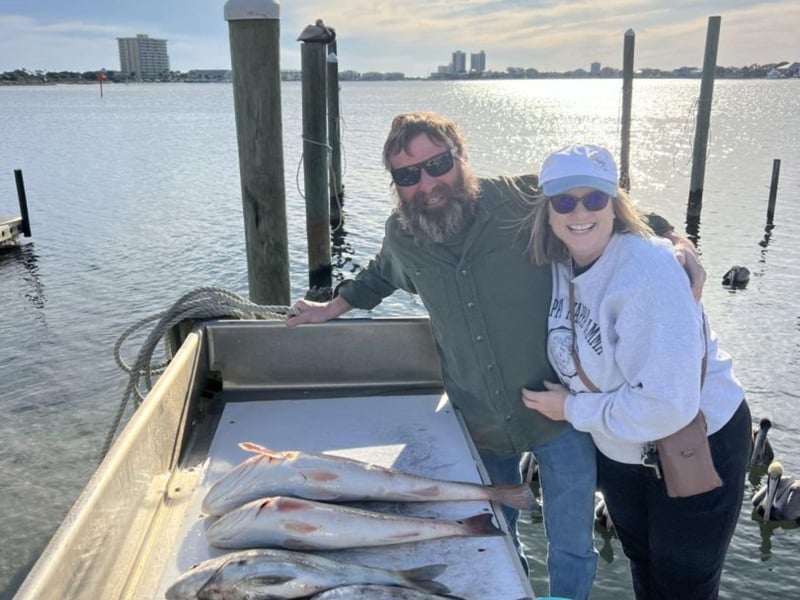 Anglers on the dock with their fish in Pensacola Beach, Florida