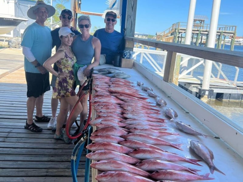 Anglers with their catches on the dock