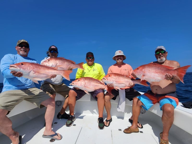 A group with their catches on the back of Necessity