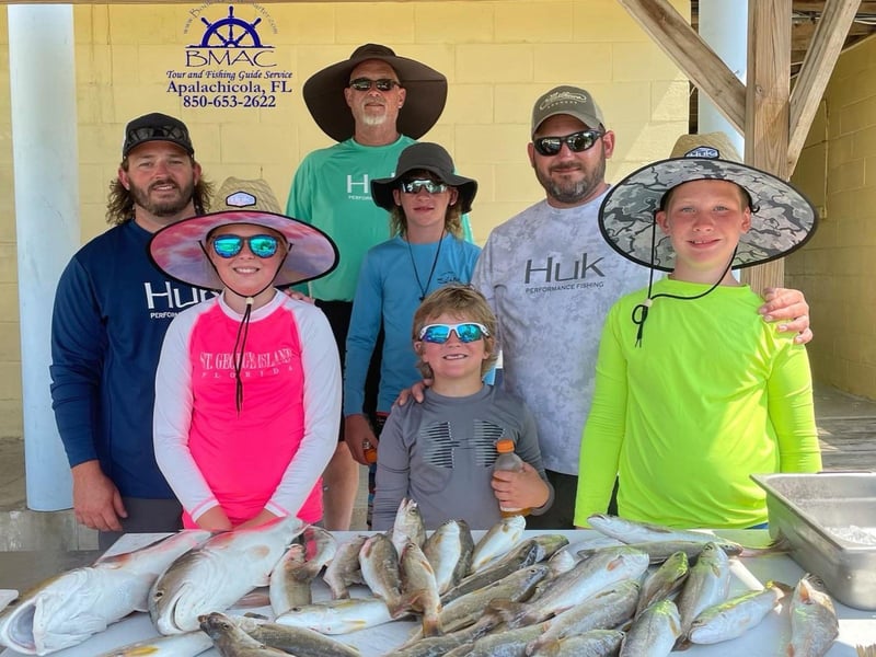 A family at the dock in Apalachicola, Florida
