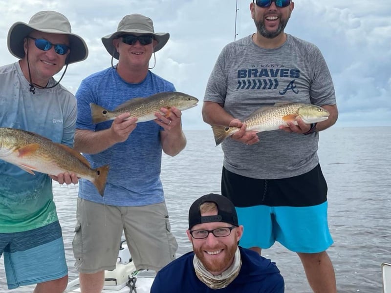 A group showing off their catches in Apalachiola, Florida