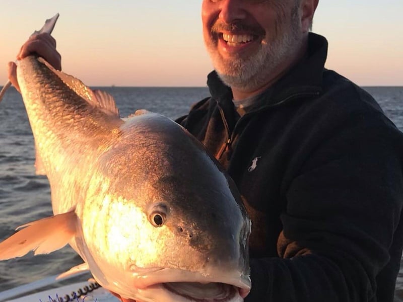 An angler with his fish in Apalachicola, Florida