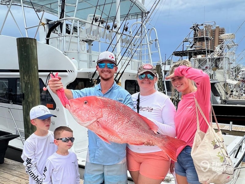 A family at the dock in Orange Beach, Alabama