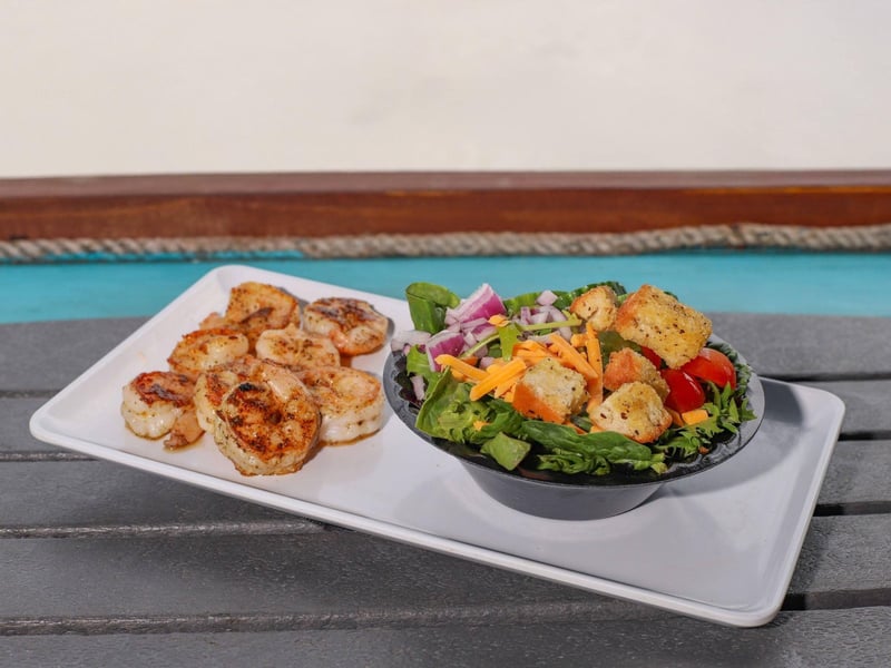 Grilled shrimp with a side salad