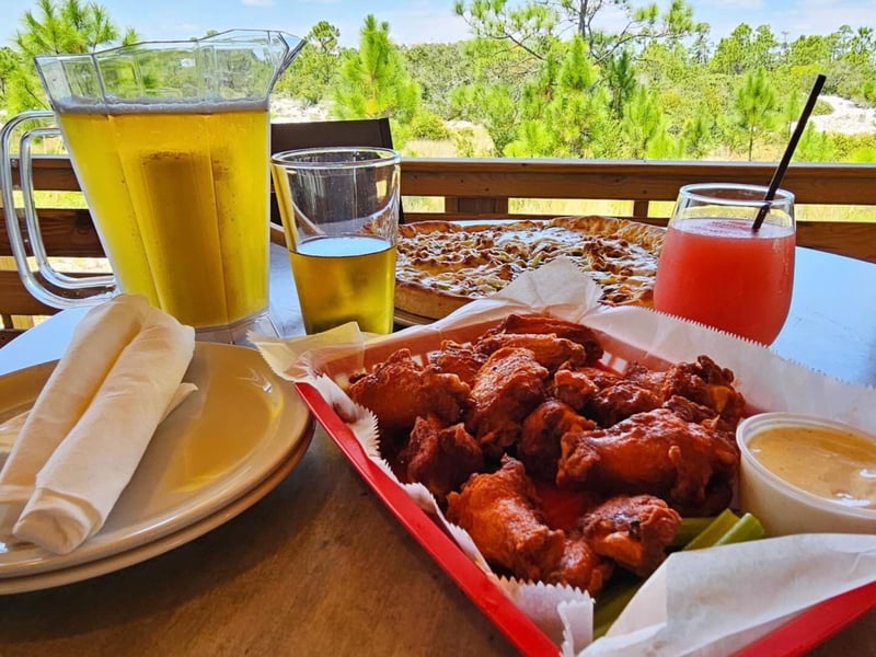 Chicken wings with a pitcher of beer