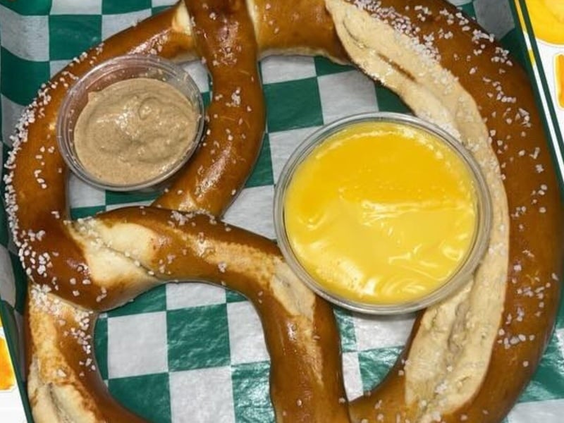 A large soft pretzel with cheese