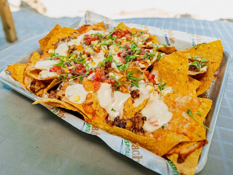 Blackened shrimp nachos wtih Old Bay queso