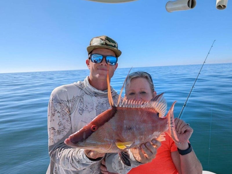 A couple with their fish near Anna Maria Island, Florida
