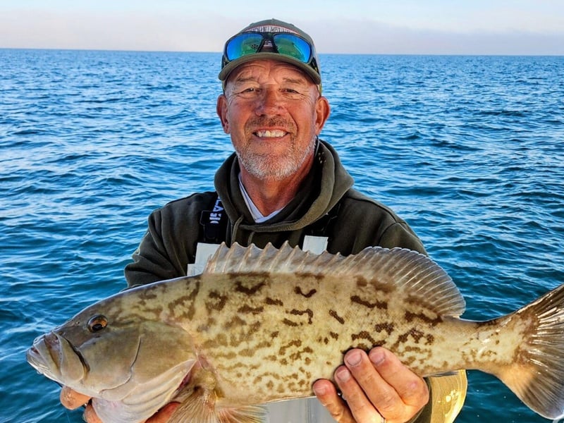A man with his fish off the coast of Anna Maria Island