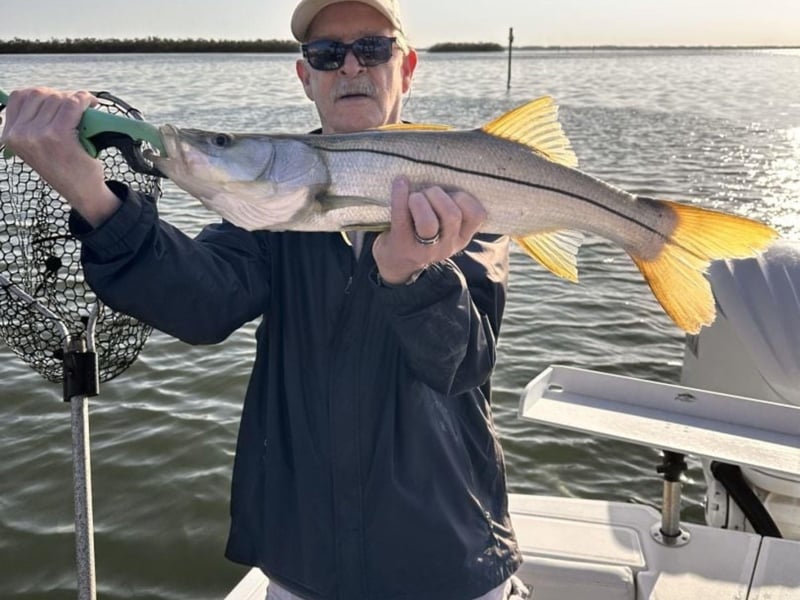 An angler with his catch on board Mother Ocean Charters