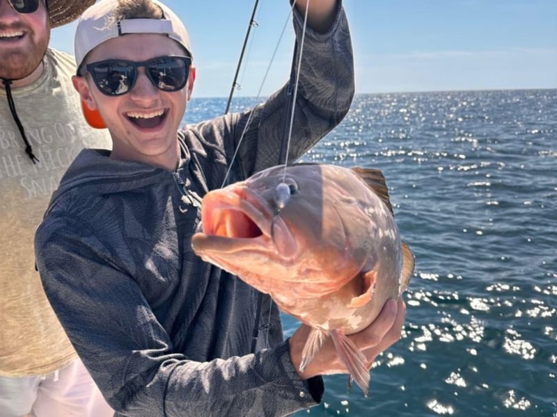 A young fisherman with his catch in Anna Maria Island