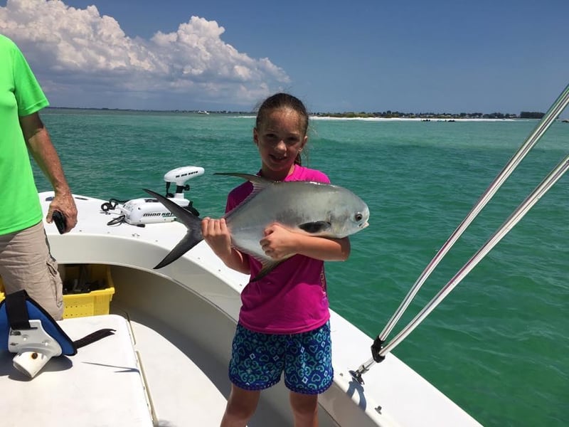A young angler on the boat in Florida