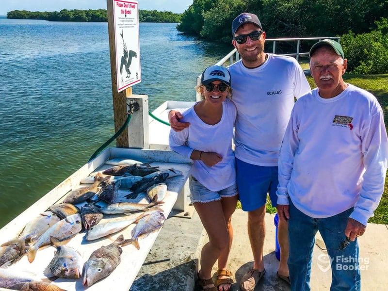 A group on the dock with their catches