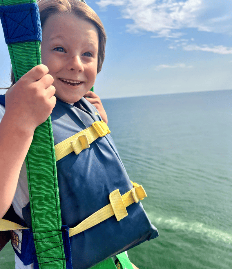child parasailing in Gulf Shores