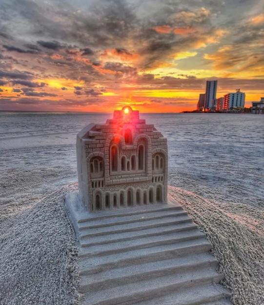 detailed sandcastle sculpture at sunset on the beach in Gulf Shores, Alabama