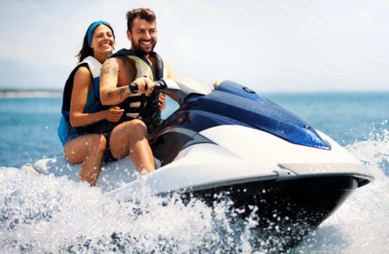 couple riding a jet ski together on the water in Gulf Shores, Alabama