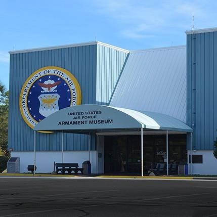 Exterior of the United States Air Force Armament Museum entrance with official signage