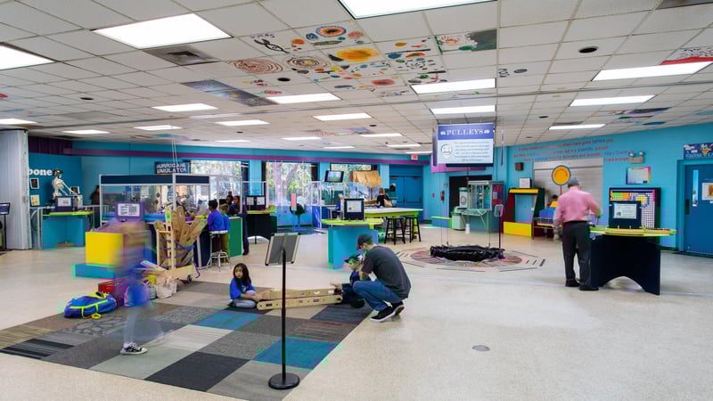 Children and families exploring interactive exhibits inside Emerald Coast Science Center in Fort Walton Beach