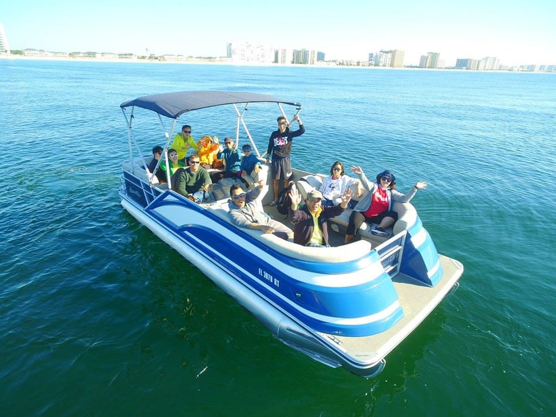 Group of people enjoying pontoon boat ride in Fort Walton Beach near Destin harbor