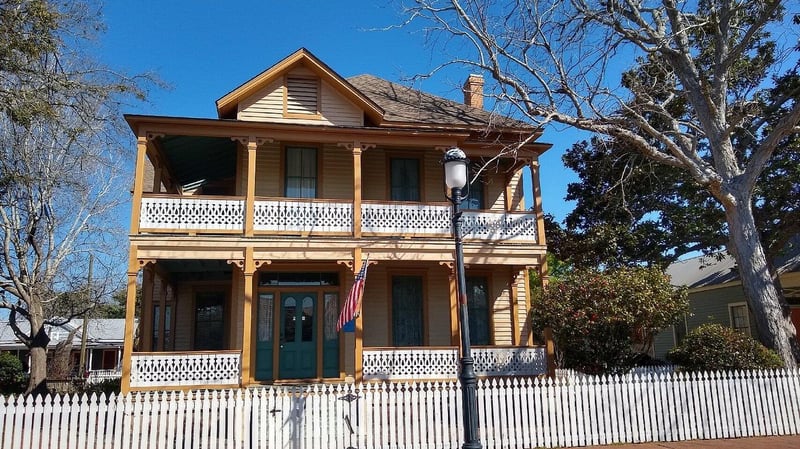 Colorful historic house with front porch in Pensacola Village district