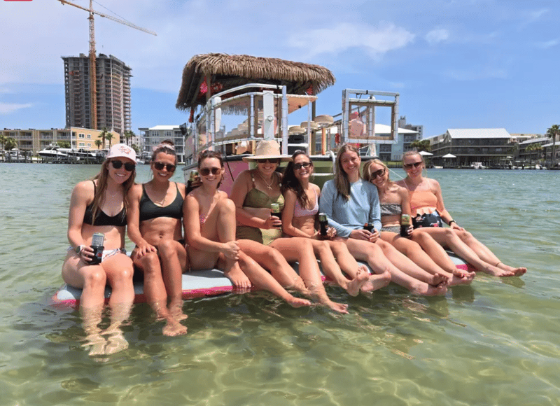 Tiki cruise anchors for a group swim at Orange Beach, AL