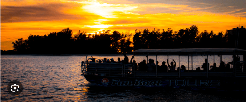 Friends enjoying a sunset cruise on the FunBoat