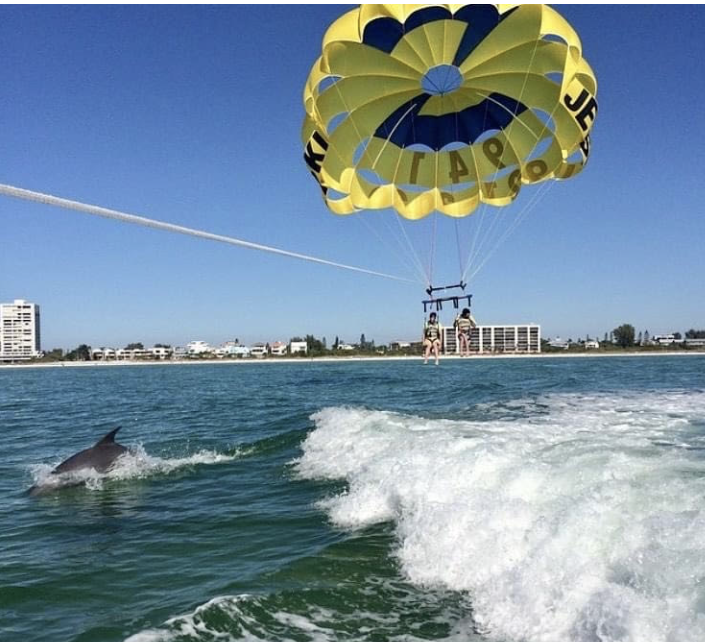 Guests soaring above the crystalclear waters of Siesta Key