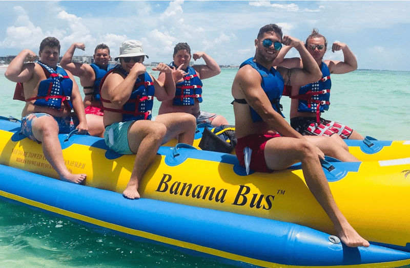 Group enjoying a thrilling banana boat ride in Siesta Key