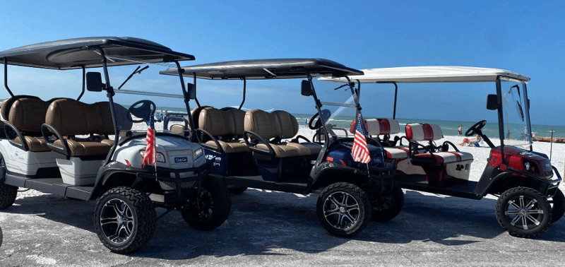 Golf cart parked near the beach on a sunny island afternoon