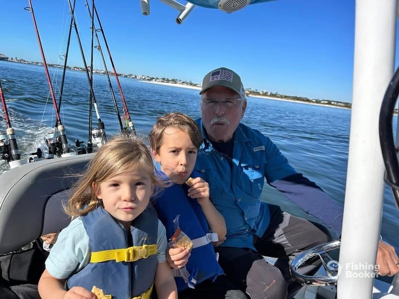 Kids enjoying a fishing trip aboard Reel Krazy in Orange Beach, AL