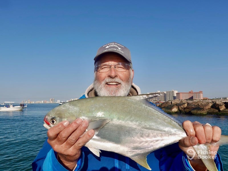 Flounder and fisherman on the Reel Krazy fishing charter in Orange Beach, AL