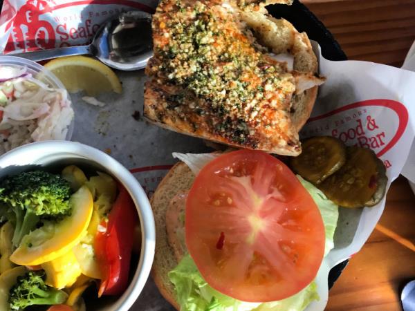 The classic fish sandwich at AJs is always fresh and delicious. It comes with fries but you can substitute steamed veggies for a healthy kick.