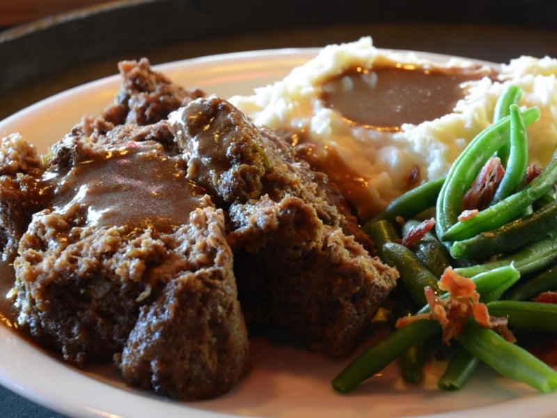 Homemade meatloaf with mashed potatoes and green beans