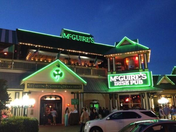 McGuires Irish Pub with Green Lights on Full Display