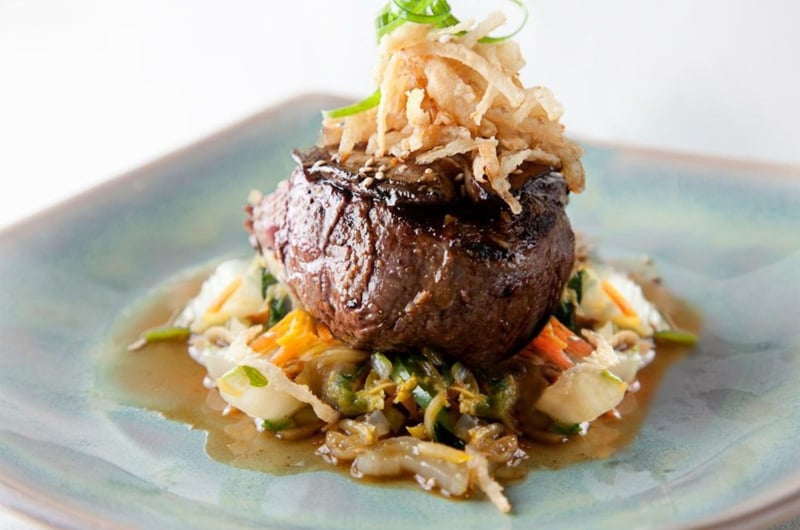 Grilled beef tenderloin with a house teriyaki sauce, portobello mushroom and tempura onion