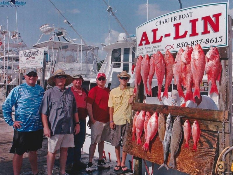 Fisher on the dock next to Red Snapper