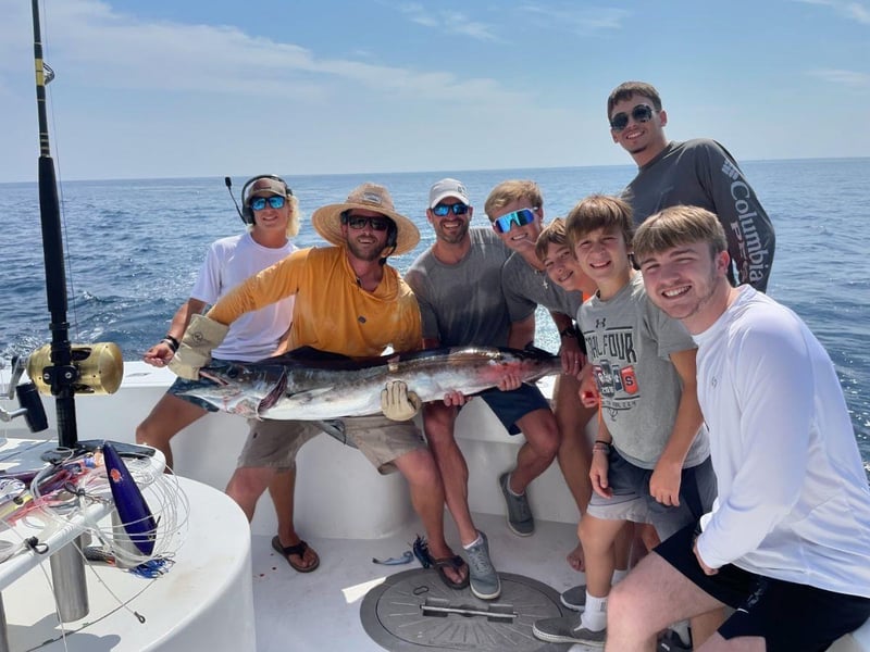 A group with a catch aboard Backlash off the coast of Destin, Florida