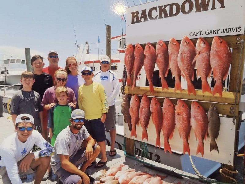 A group with their catch on the dock in Destin, Florida