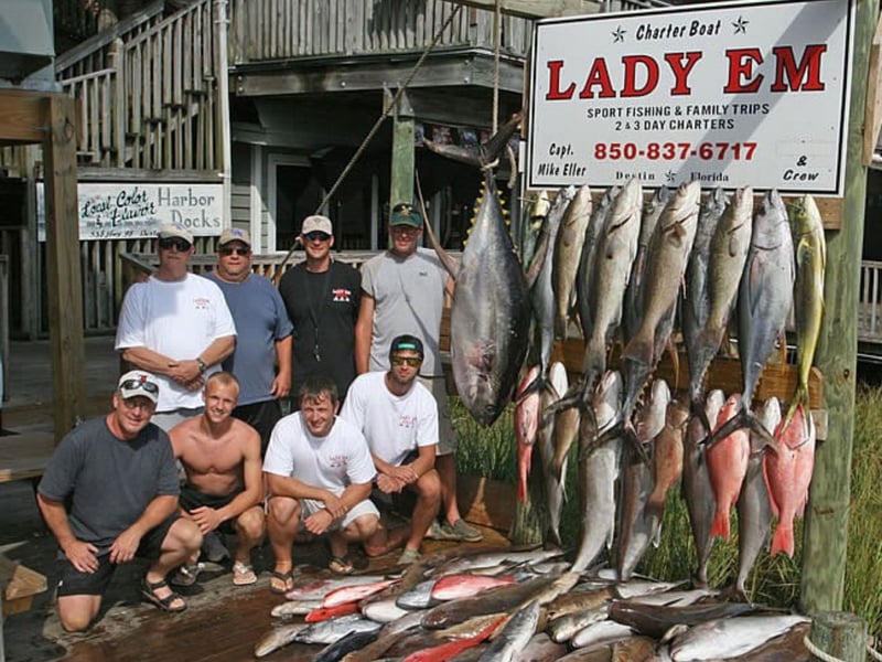 A group on the dock with their catches from a trip with Lady Em