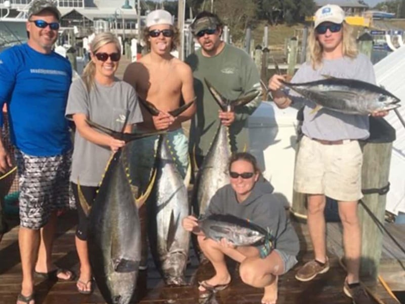 A group showing off their catches from No Alibi