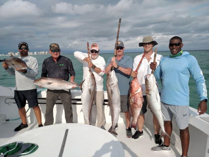A group with their catch on board the Phoenix