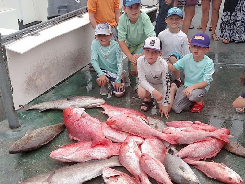 A family with their catches from Charter Boat Phoenix