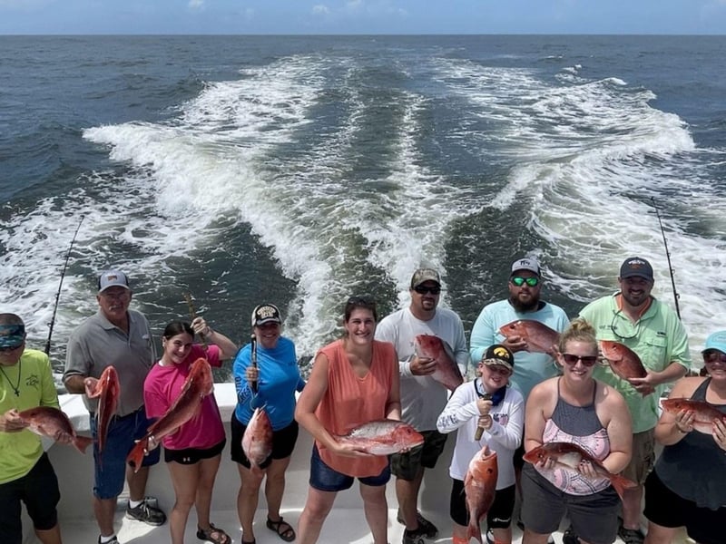 A large group on the back of Summer Breeze in Orange Beach, Alabama