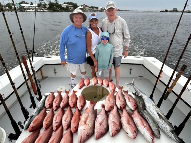 A family with their catch on board Boll Weevil