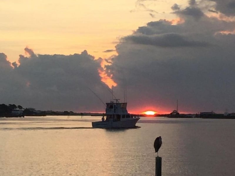 Cool Change Charters on the water at sunset in Orange Beach, Alabama