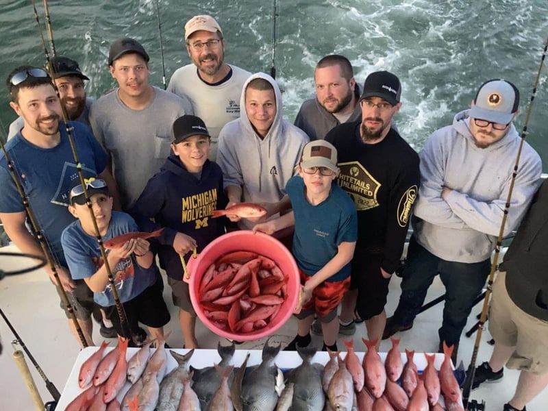 A group with their catch on Fairwater II in Orange Beach, Alabama