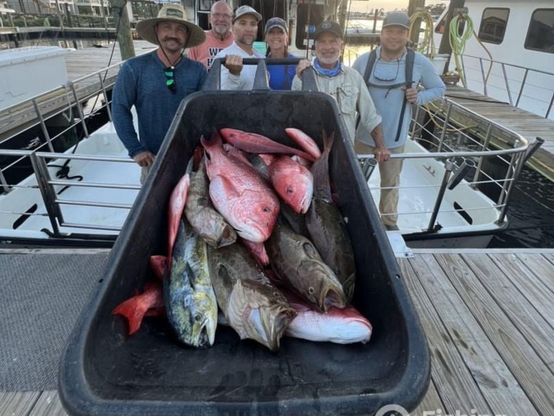 Anglers with their fish at the dock