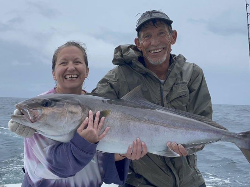 A group showing off their catch on Jamie G Charters in Orange Beach, Alabama